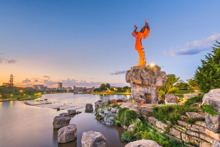 Keeper of the Plains overlooking the Arkansas River at dusk.